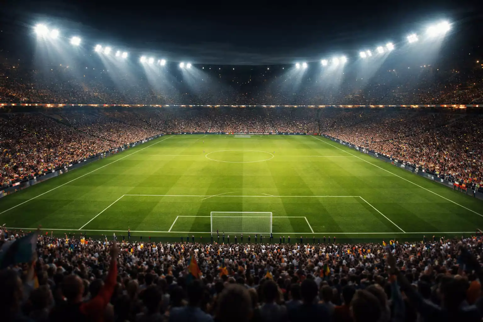 Stadio di calcio illuminato durante partita serale